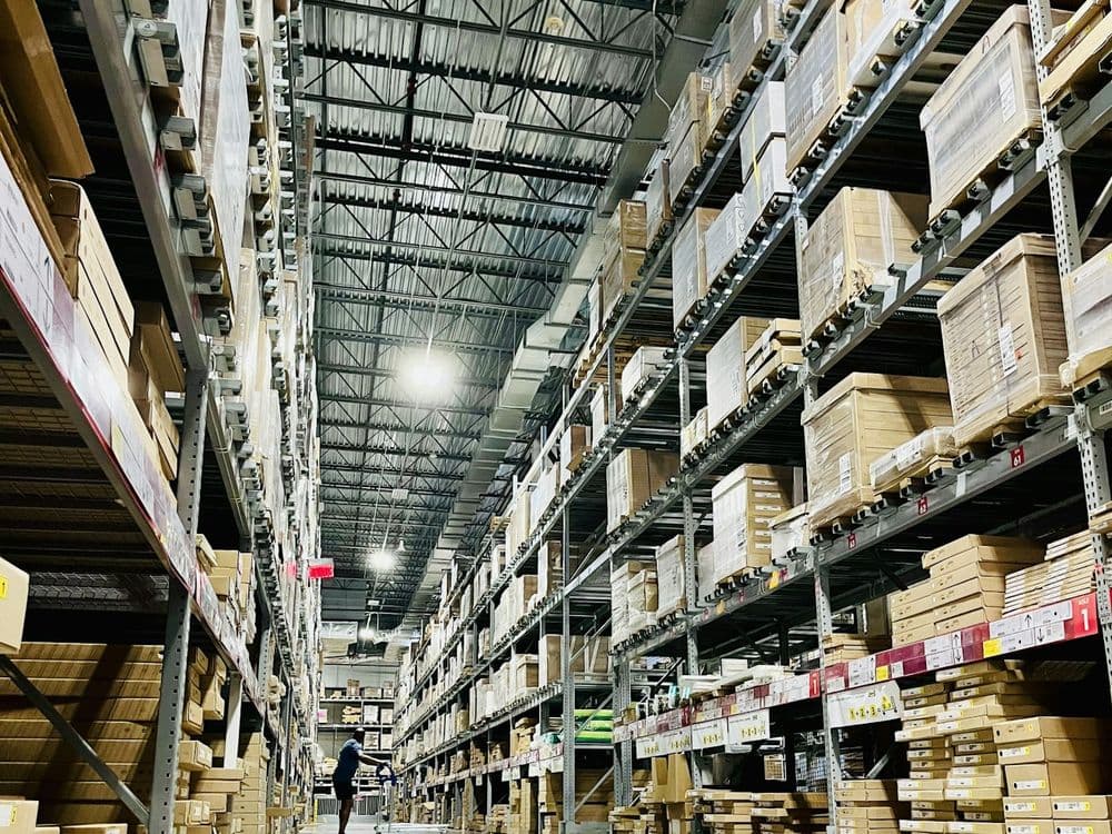 Tall pallet racking aisle in a warehouse used for cargo staging